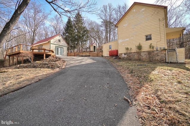 view of property exterior featuring a deck