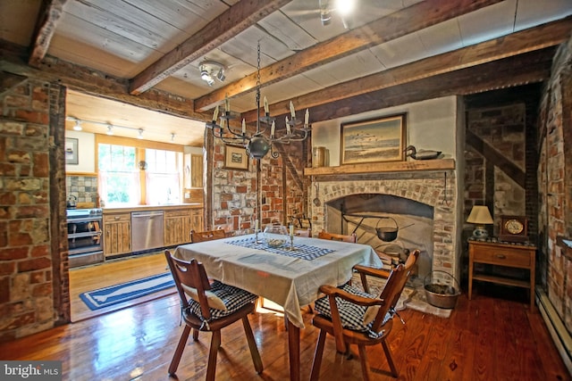 dining space featuring rail lighting, wood ceiling, hardwood / wood-style flooring, a baseboard radiator, and beamed ceiling