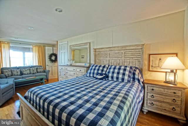 bedroom featuring dark wood-type flooring