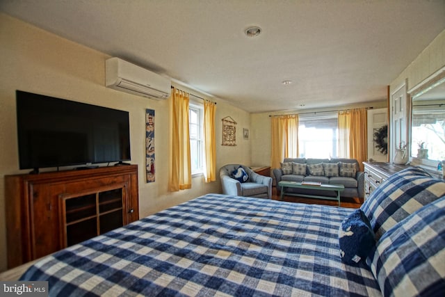 bedroom with a wall unit AC