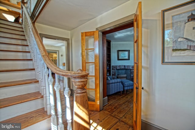 staircase featuring a fireplace