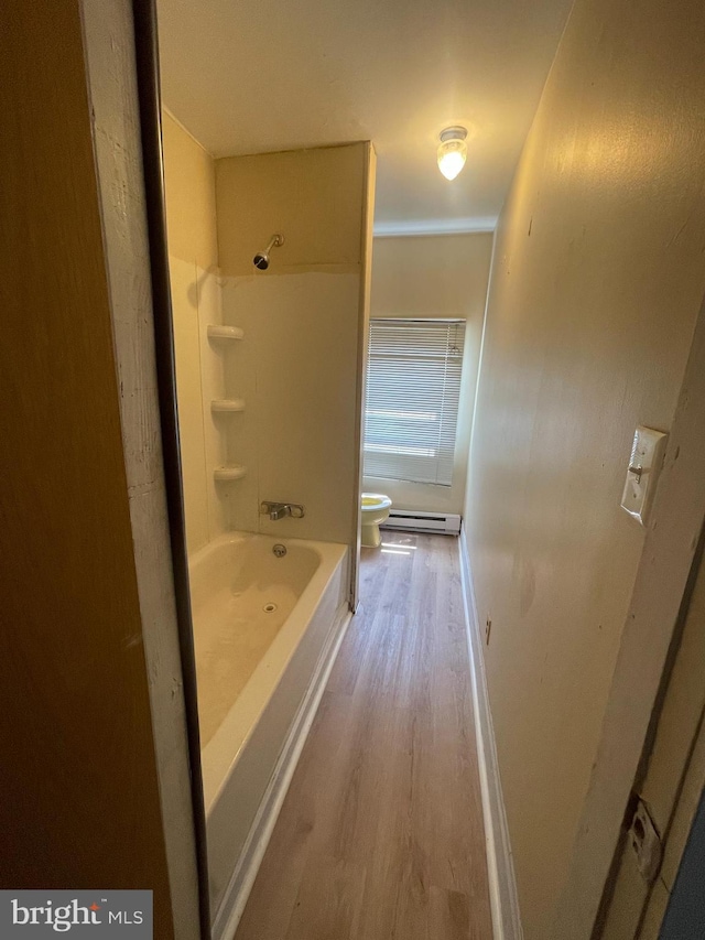 bathroom featuring baseboard heating, shower / tub combination, wood-type flooring, toilet, and ornamental molding