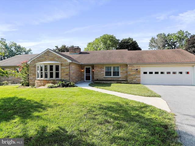 single story home with a garage and a front yard