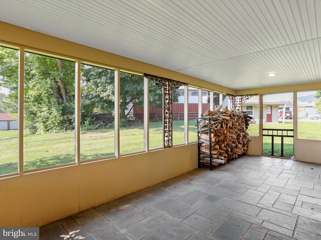 unfurnished sunroom with plenty of natural light