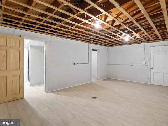 basement featuring hardwood / wood-style flooring