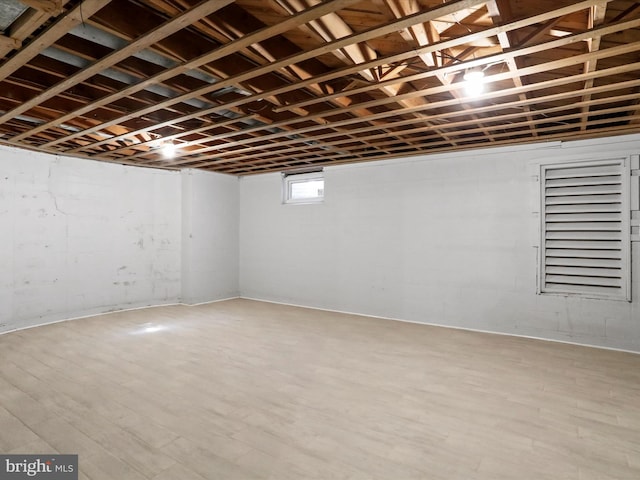 basement featuring light hardwood / wood-style flooring