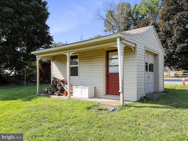 exterior space with a garage and a yard