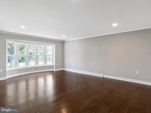 unfurnished room with ornamental molding, a baseboard heating unit, and dark hardwood / wood-style flooring