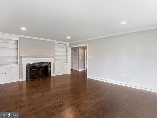 unfurnished living room with crown molding, a high end fireplace, and dark hardwood / wood-style floors