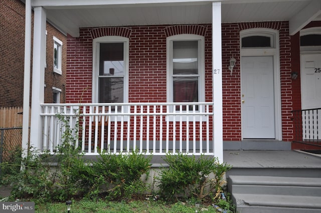 doorway to property with a porch