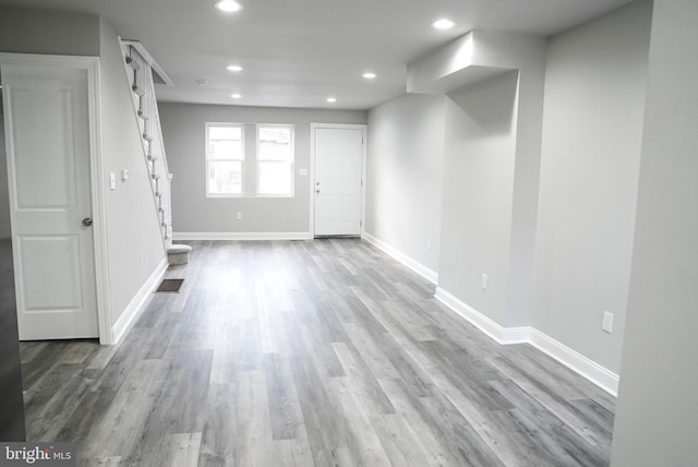 unfurnished room with hardwood / wood-style floors