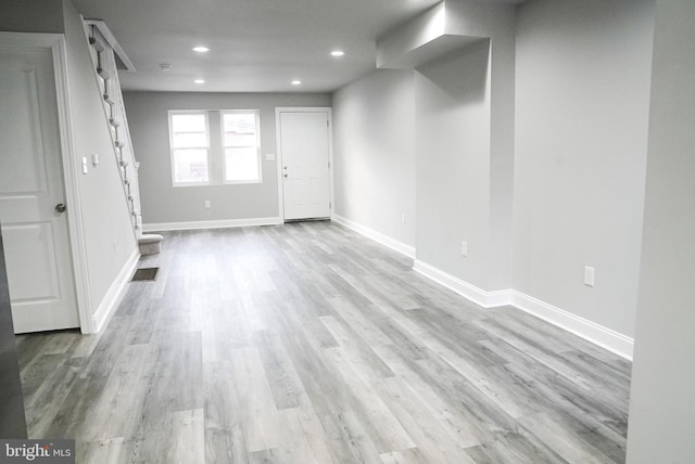 unfurnished room featuring light wood-type flooring