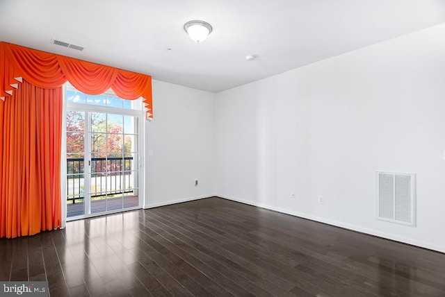 unfurnished room featuring dark hardwood / wood-style floors