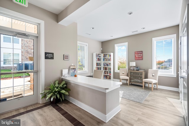 office with light hardwood / wood-style flooring