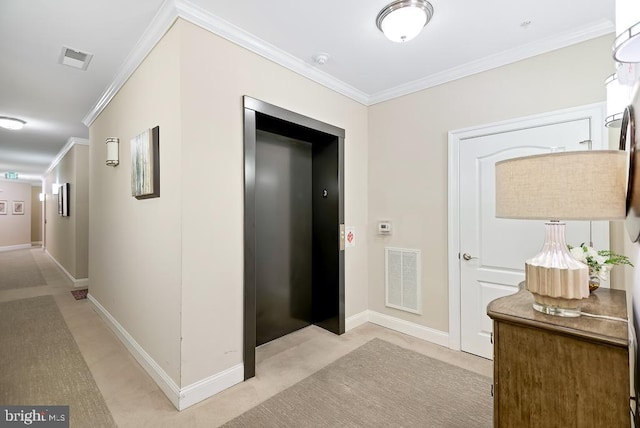 hallway featuring ornamental molding, elevator, and light colored carpet