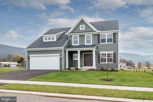 view of front of property with a mountain view and a front yard