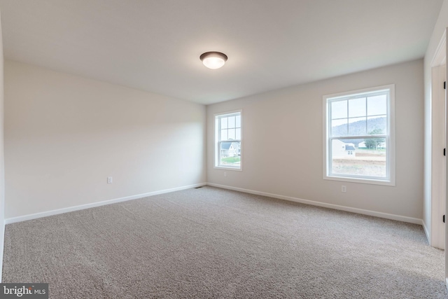 view of carpeted spare room