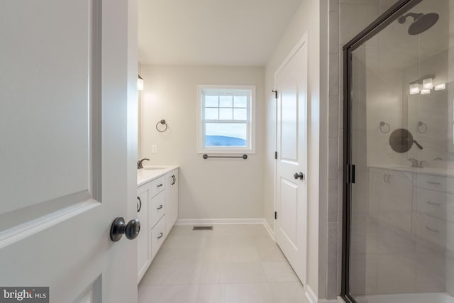 bathroom featuring an enclosed shower and vanity