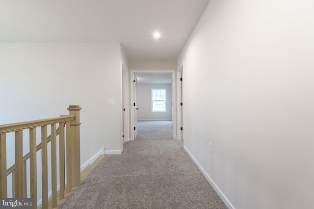 hallway with light carpet