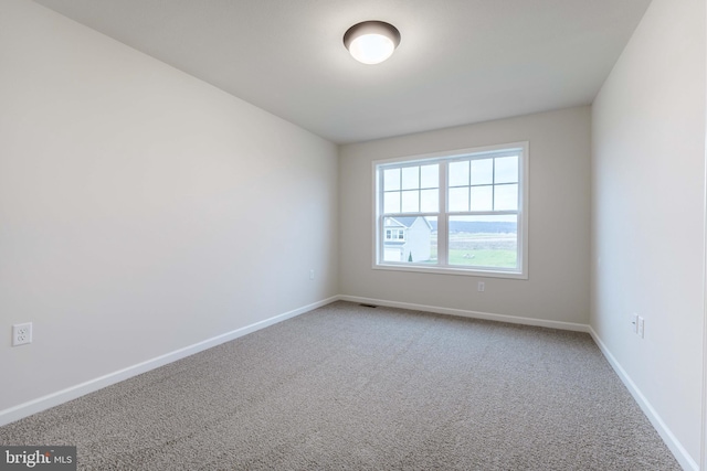 spare room featuring carpet flooring