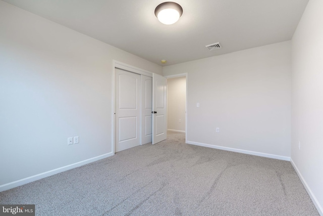 spare room featuring carpet flooring