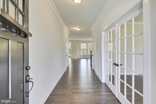 hall featuring ornamental molding and dark hardwood / wood-style flooring