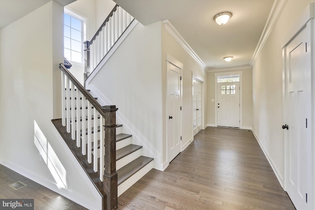 entrance foyer featuring hardwood / wood-style floors and ornamental molding