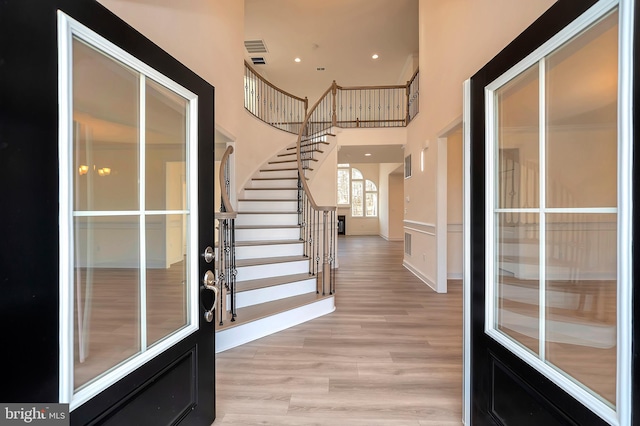 entrance foyer with light hardwood / wood-style flooring