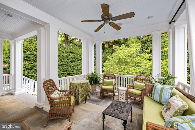 sunroom / solarium with ceiling fan and a healthy amount of sunlight