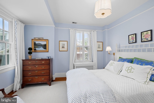 bedroom with multiple windows