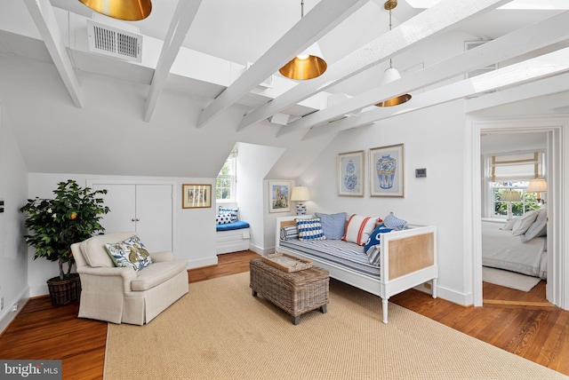 living room featuring hardwood / wood-style flooring and lofted ceiling with beams