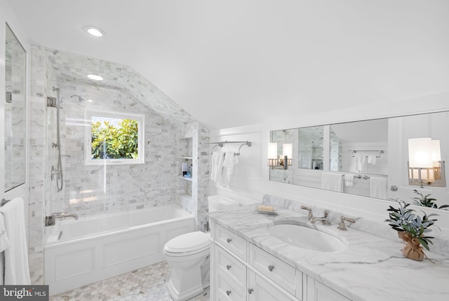 full bathroom with toilet, tiled shower / bath, vanity, and lofted ceiling