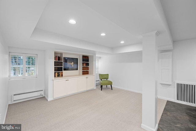 living area featuring a baseboard radiator and light colored carpet