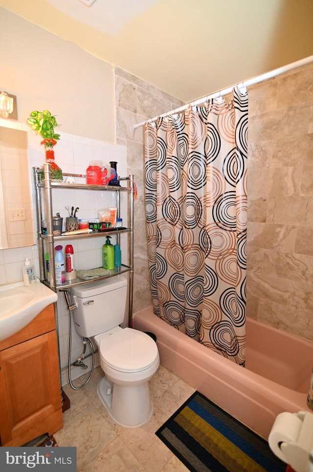 full bathroom with vanity, shower / bath combo, tile walls, toilet, and backsplash