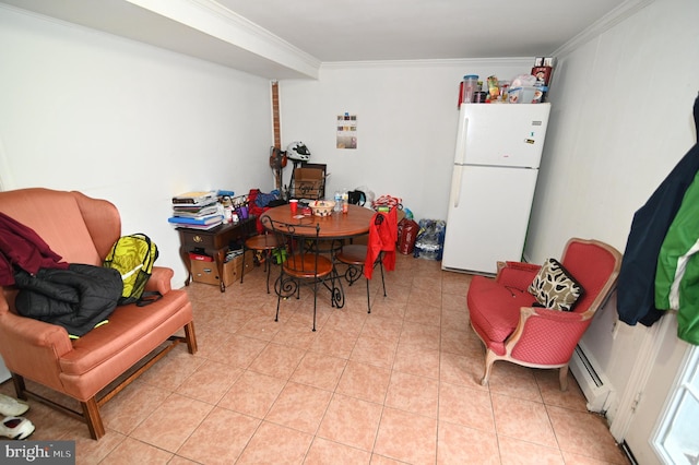 dining space with light tile patterned floors, baseboard heating, and crown molding