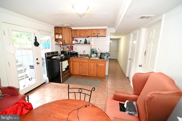 kitchen featuring visible vents, open shelves, stainless steel appliances, crown molding, and decorative backsplash