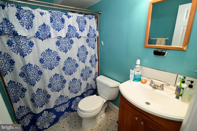 full bath with vanity, tile patterned floors, toilet, and a shower with curtain