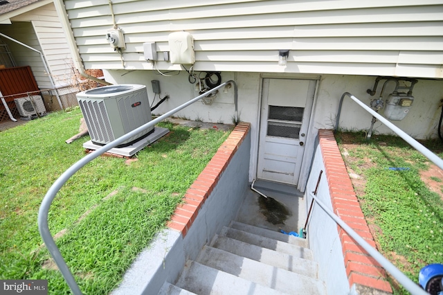 exterior space with gas meter, ac unit, and central AC