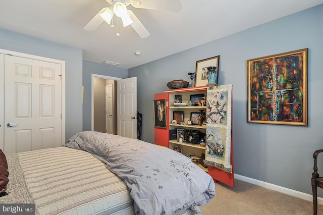 carpeted bedroom with ceiling fan