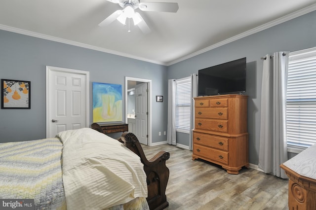 bedroom with wood-type flooring, ornamental molding, and ceiling fan