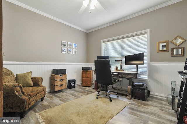 home office featuring hardwood / wood-style flooring, ornamental molding, and ceiling fan