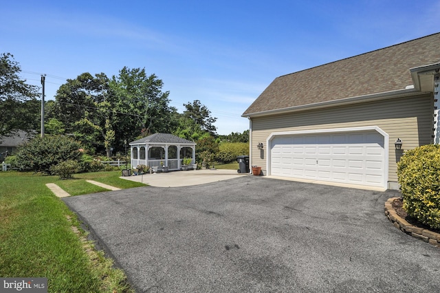 garage featuring a yard