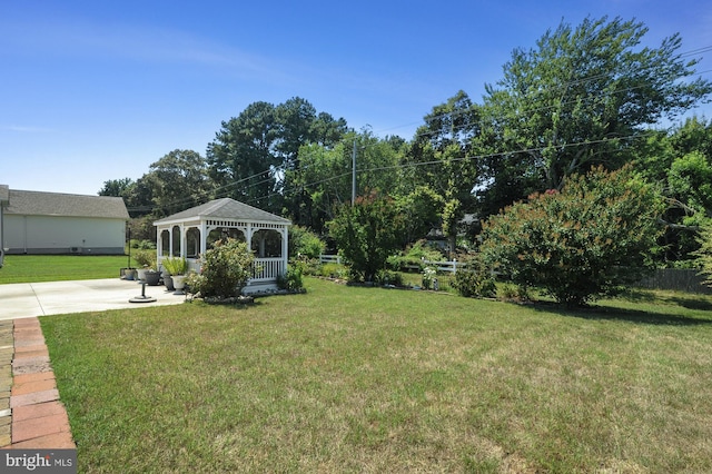 view of yard featuring a gazebo and a patio area