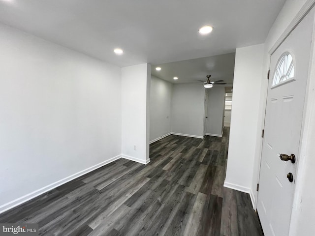 interior space with ceiling fan and dark hardwood / wood-style flooring