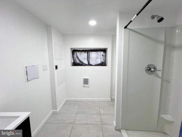 bathroom with walk in shower and vanity