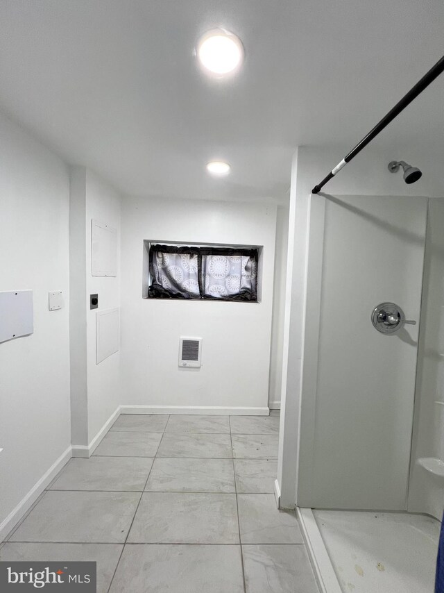 bathroom featuring walk in shower