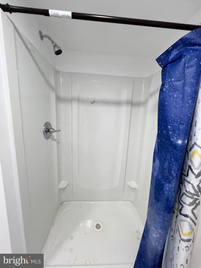 bathroom featuring walk in shower