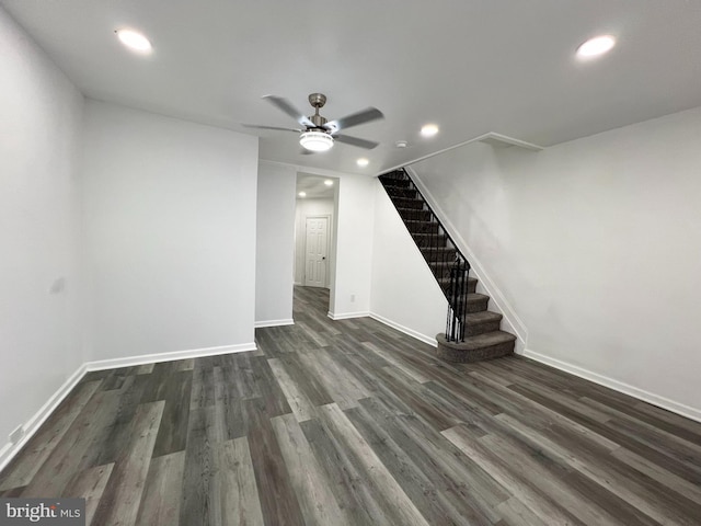 interior space featuring ceiling fan and dark hardwood / wood-style floors