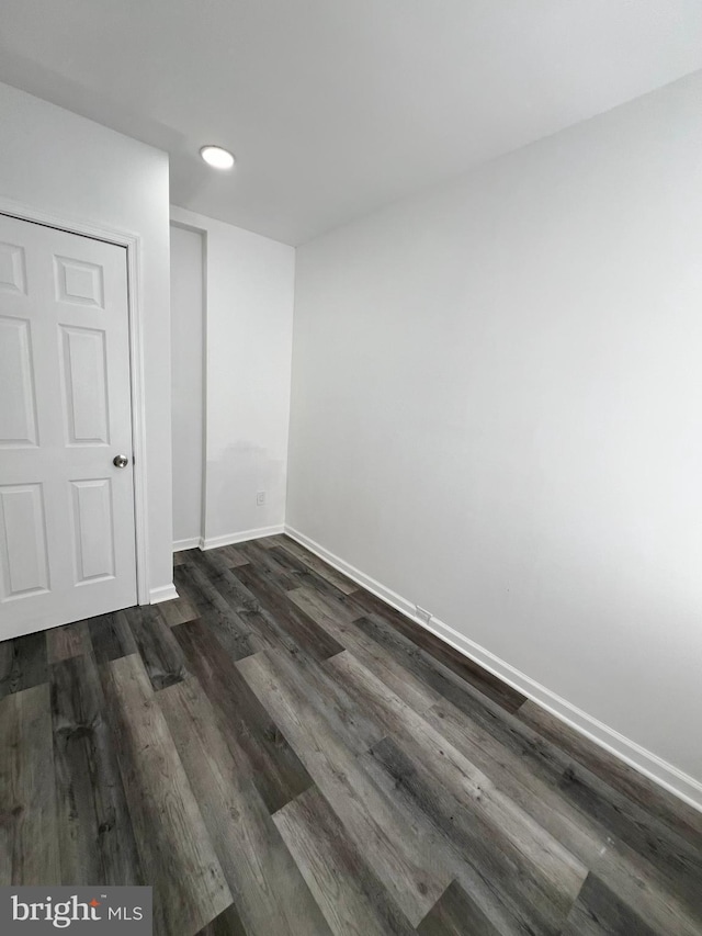 spare room featuring dark hardwood / wood-style floors