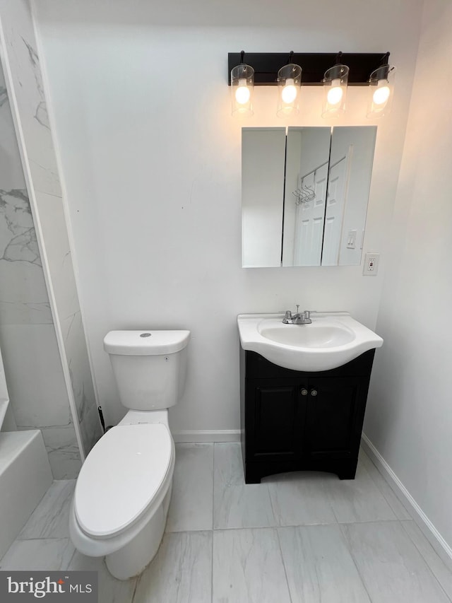 bathroom with toilet and vanity